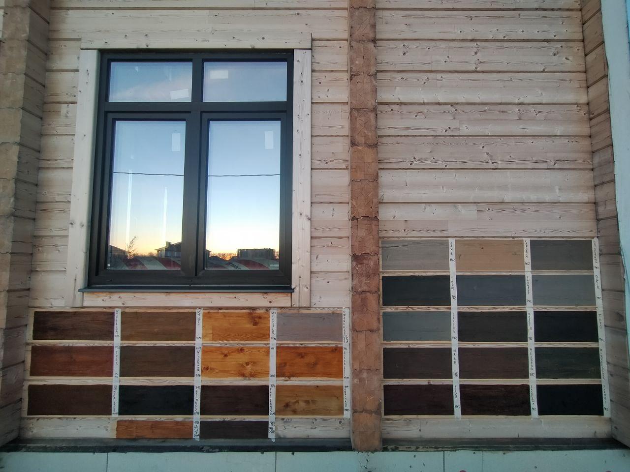 Покраска дома из клеёного бруса.