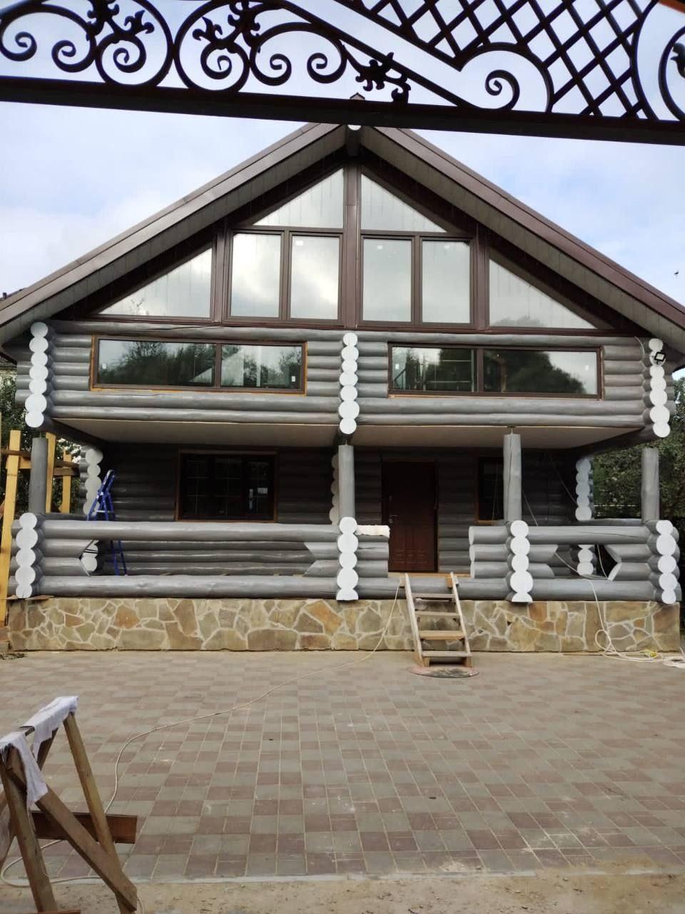 Профессиональная покраска деревянных домов из клеёного бруса.Профессиональная покраска деревянных домов из клеёного бруса.