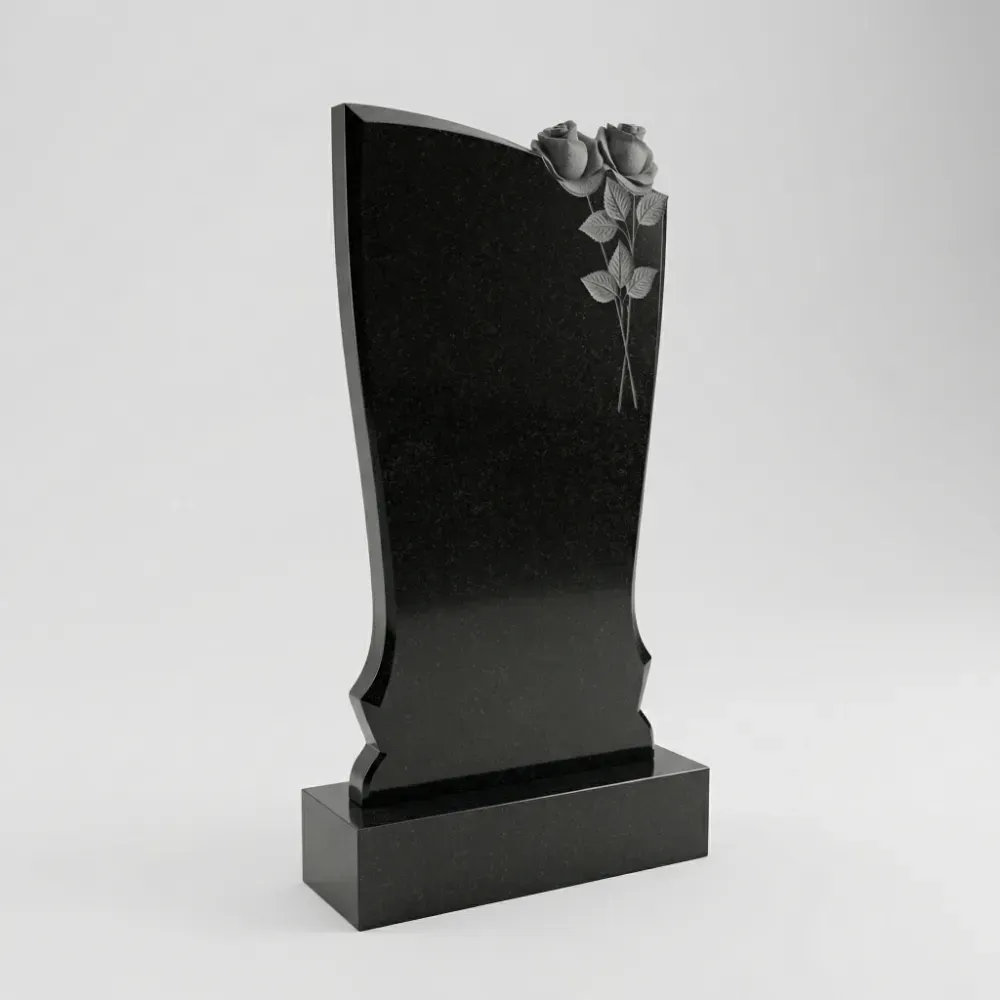 Красивый гранитный памятник с резными розами на могилу